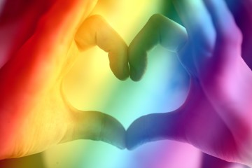 lgbtq+, rainbow, love heart formed in hands